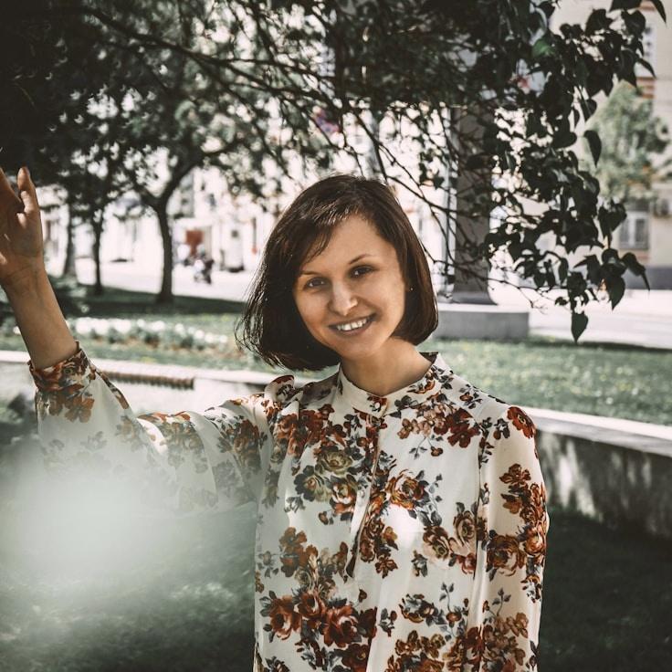 Kaveri Mehta, Lead Design Curator at CinderBrookHaven, reviewing corporate floral arrangements